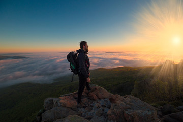 Fototapeta premium A man in mountain sunset autumn