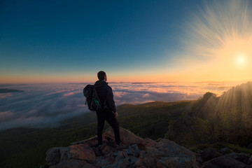 Fototapeta premium A man in mountain sunset autumn