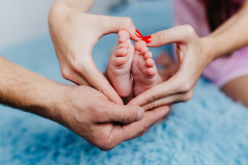 Portrait of a happy young family with a little baby boy.