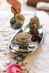 Obraz na płótnie Canvas Antique porcelain coffee cups with hot coffee