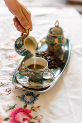 Antique porcelain coffee cups with hot coffee