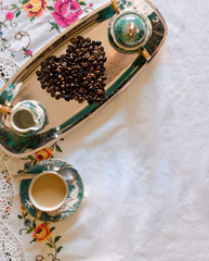 Antique porcelain coffee cups with hot coffee