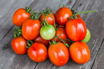 tomatoes on wooden background