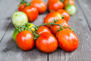 tomatoes on wooden background
