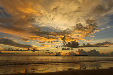 Scenic sunset over ocean beach.