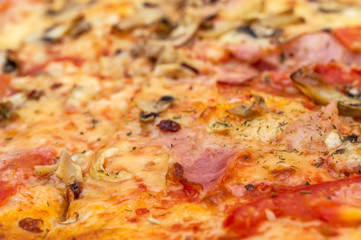 Cutted pizza as food background. Close up.