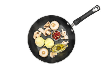 Frying pan with raw champignon with spices on white. Cooking food. Top view.