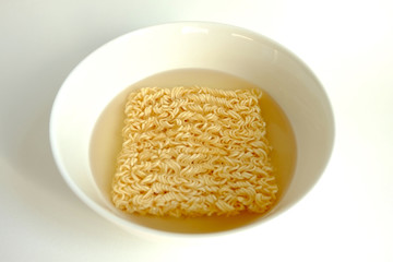 Instant noodle in white ceramic bowl
