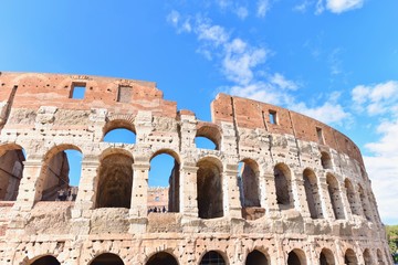 Obraz premium The Ancient Roman Colosseum Against Blue Skies