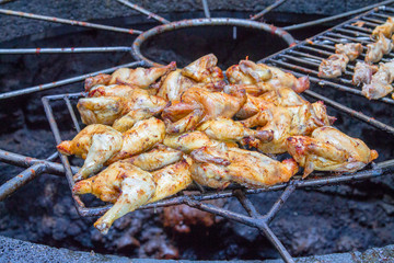 Chicken legs on the grill grill over the natural heat of a volcano in the El Diablo Canary Islands National Park. Spain Lanserote