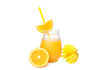 Glass jar with fresh orange juice, tubule, decorative palm and orange isolated on white background. Fresh natural drink