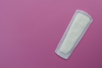 Sanitary napkin on a pink background.
