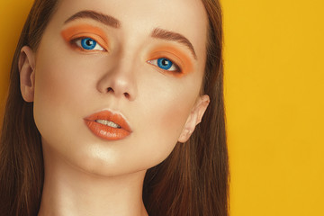Multi-colored lenses for eyes. Blue lenses, green lenses. Beauty Model Girl with orange...