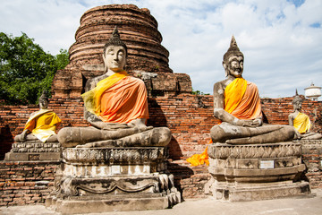 Fototapeta na wymiar Apprentices of Buddha at Wat Yai Chai Mongkol, Ayutthaya, Thailand
