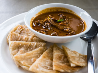 Roasted duck in red curry with roti