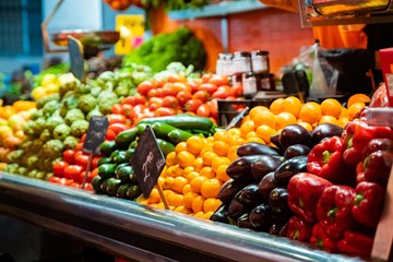 Vegetable stall on bazaar with colorful vegetables and fruits