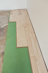 Minsk, Belarus - April 23, 2019: View of the process of installation and installation of new flooring in the interior decoration of the apartment