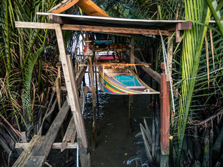 Fototapeta na wymiar Thai boat lifted from the water, Bang Krachao, Bangkok, Thailand