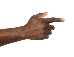 African-American man pointing at something on white background, closeup