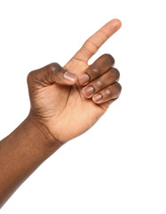 African-American man pointing at something on white background, closeup
