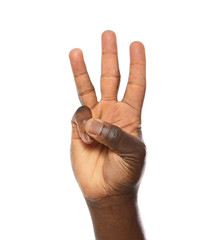 African-American man showing number THREE on white background, closeup