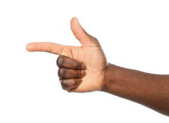 African-American man pointing at something on white background, closeup