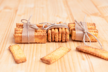 Salted crackers chained with string,  with space for text