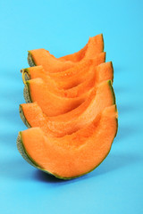 Melon fruit on blue background