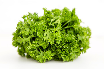 bunch of fresh greens tied with a centimeter ribbon and a notebook. the concept of proper healthy nutrition. weight control, diet