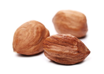Peeled hazelnuts isolated on white background