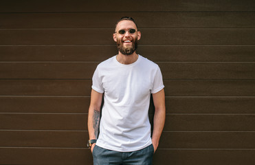 Handsome hipster model wearing white blank t-shirt