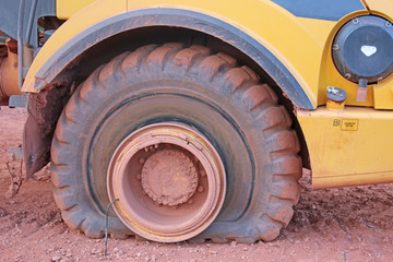 Fototapeta premium Dump truck with a flat tyre