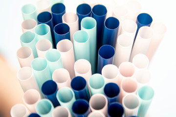 Colorful drinking straws background. Plastic tubes concept.