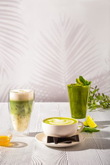 Assortment of matcha green tea beverages - ice green tea, frappe and hot milk green tea