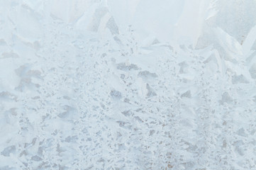 Fototapeta premium Frosty patterns on a frozen ice box in the early morning