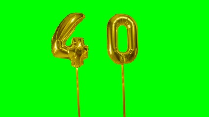 Number 40 forty years birthday anniversary gold balloon floating on green screen