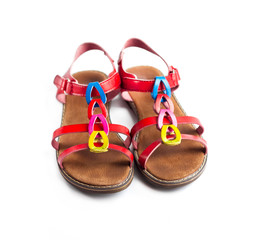 Pair of colorful female sandals on white background