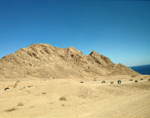 Desert land with mountains and sea