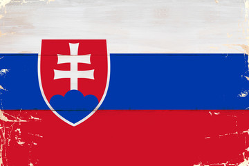 Flaga Słowacji malowana na starej desce.