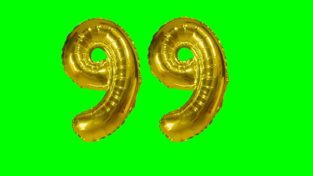 Number 99 ninety nine years birthday anniversary golden balloon floating on green screen