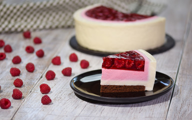 Piece of raspberry cream mousse cake. Piece of Cake on a Plate. Sweet food.