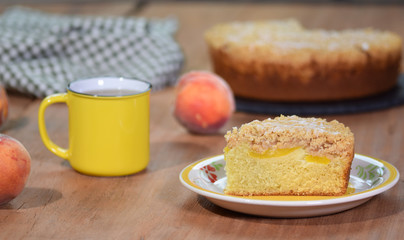 A piece of freshly baked crumb peach cake