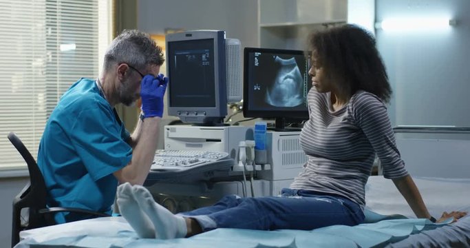 Doctor explaining diagnosis to a woman