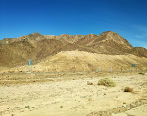Road going through Sinai mountains, hills and desert