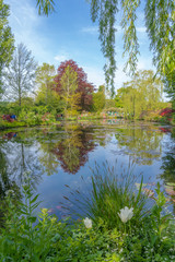 Fototapeta na wymiar Giverny, France - 05 07 2019: The gardens of Claude Monet in Giverny. The nympheas