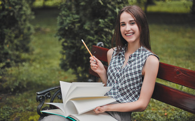 Cheerful student in the park