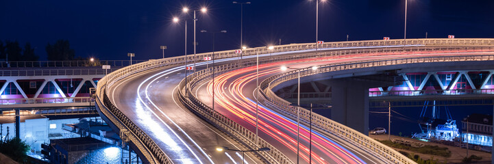 Road car light streaks. Night light painting stripes. Long exposure photography.