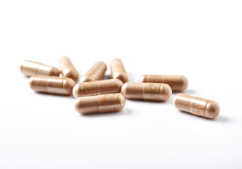 Reishi Mushroom capsules. Concept for a healthy dietary supplementation. White background. Close up. 