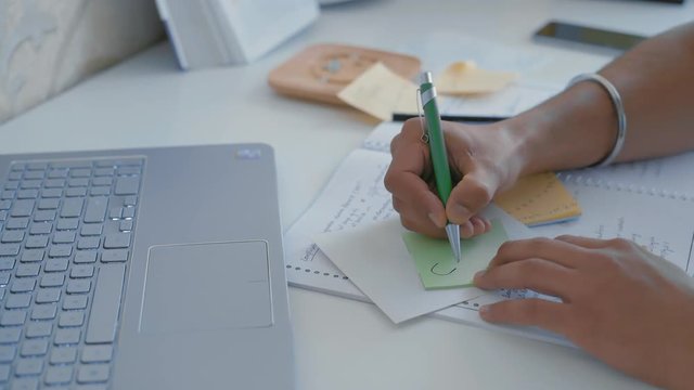 Close-up, Indian Student's Hands Draw a Tablet on Sticker