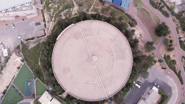 Large Water tank Aerial view Flight footage over large water tank in Jerusalem israel